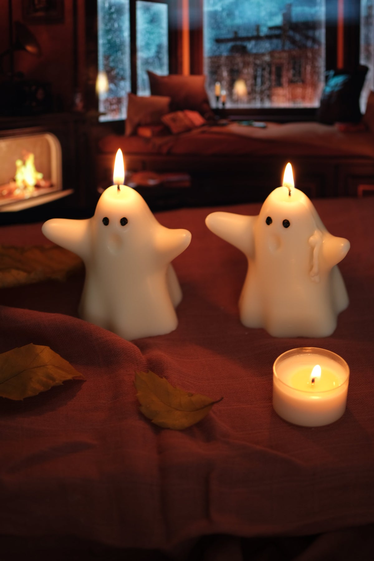 Group of handmade white soy wax ghost candles for Halloween