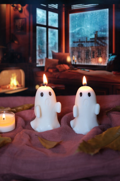 Group of handmade white soy wax ghost candles for Halloween