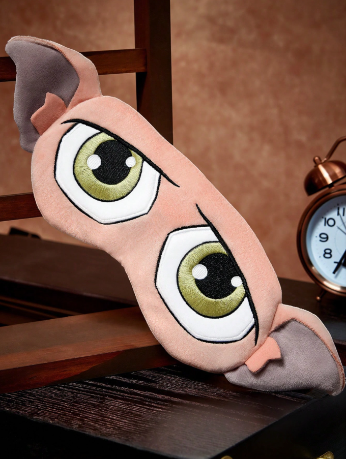 A soft bedtime eye mask featuring the printed face and ears of Dobby the Elf from Harry Potter.
