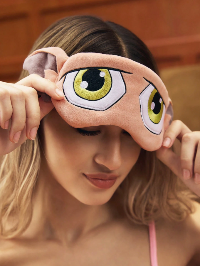 A soft bedtime eye mask featuring the printed face and ears of Dobby the Elf from Harry Potter.