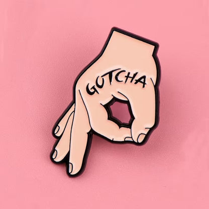 Gotcha hand pin badge